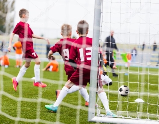 depositphotos_63612617-stock-photo-boys-playing-football-soccer-game