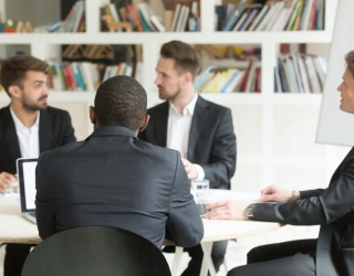 multiethnic-team-male-coworkers-discussing-corporate-plans-briefing_1163-3921